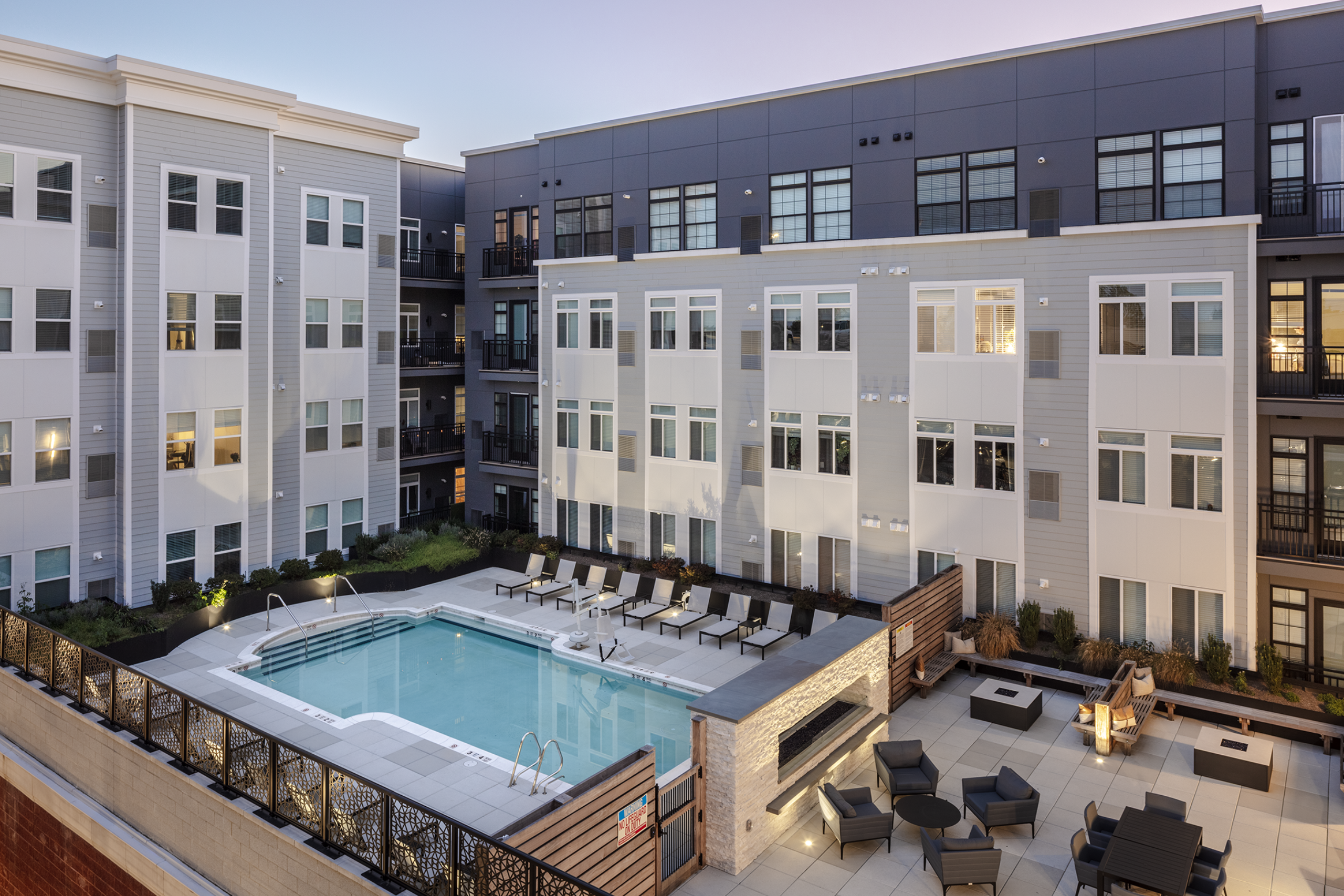 the pool and lounge chairs and tables at The Core