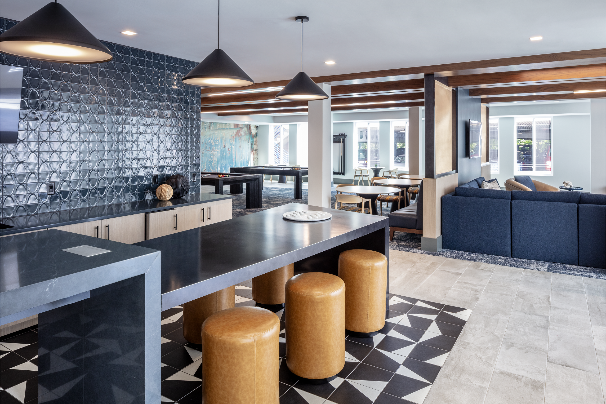 wine tasting lounge with a bar with seating and couches