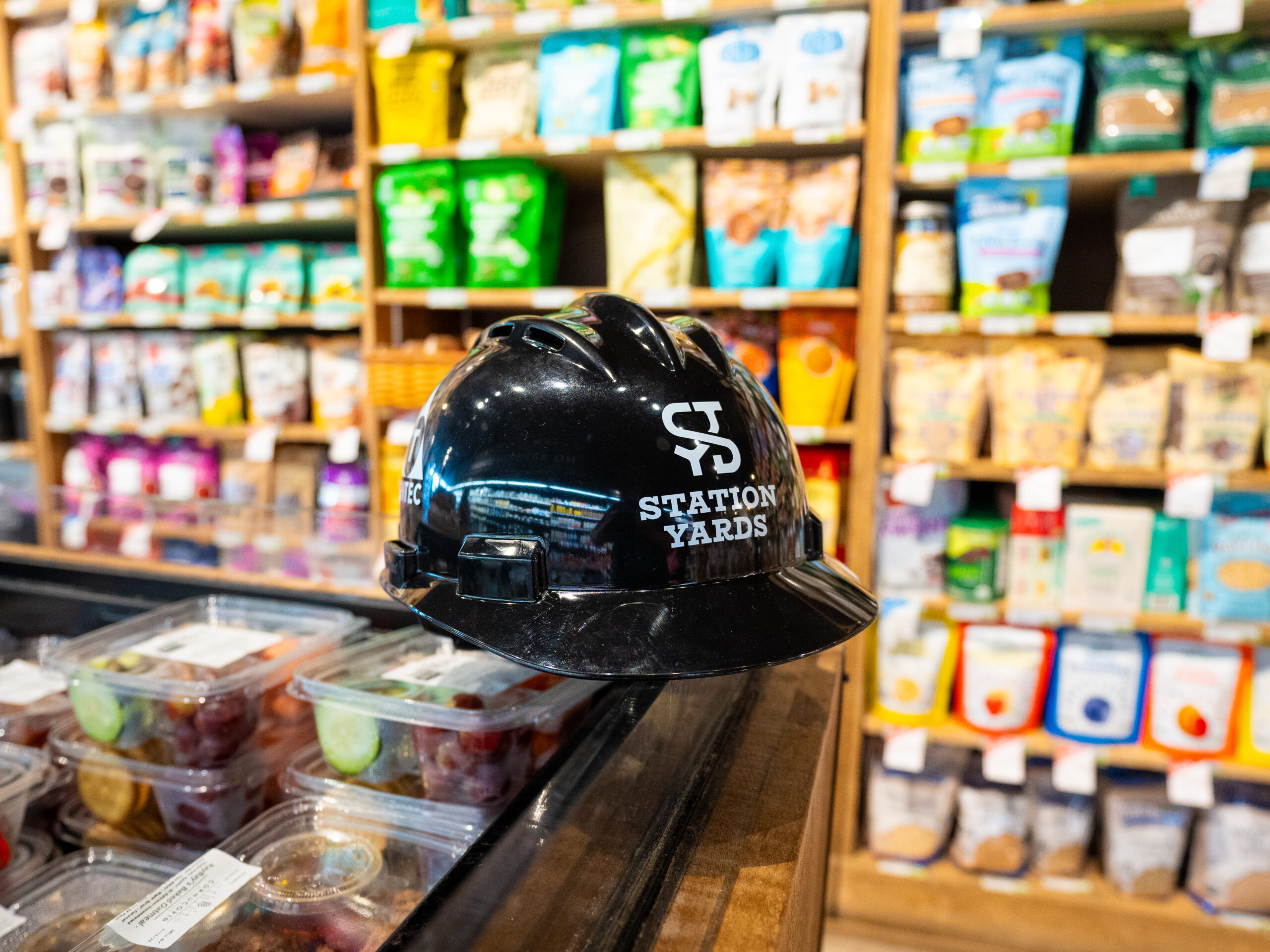 Station Yards hardhat at Cornucopia Natural Foods counter