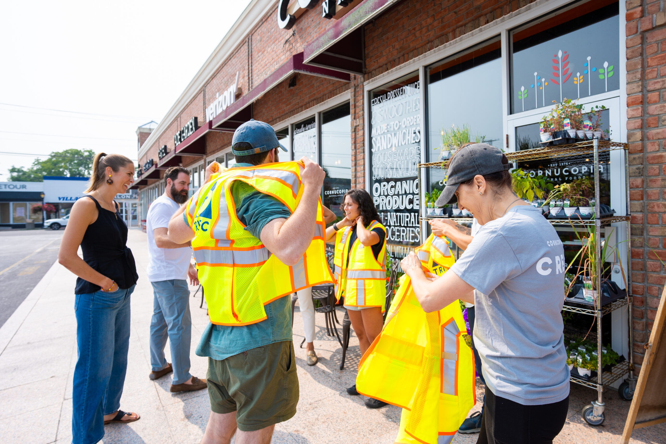 The Cornucopia Natural Foods team putting on Station Yards safety vests