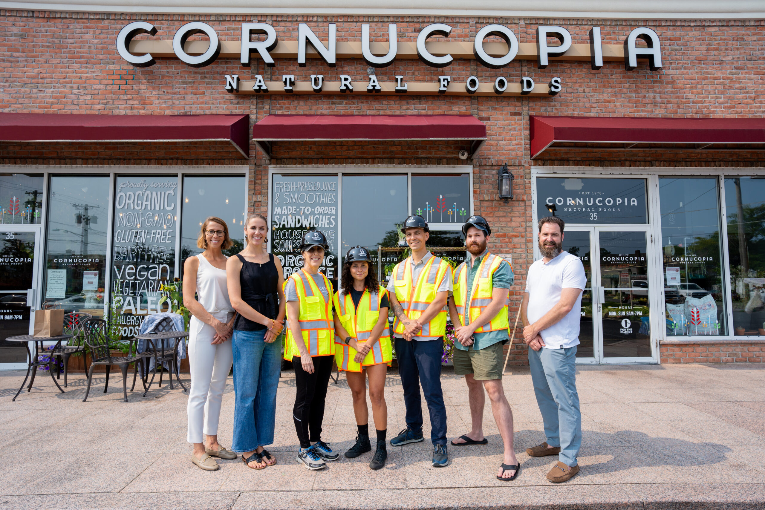 The TRITEC Development team smiling with the Cornucopia Natural Foods team