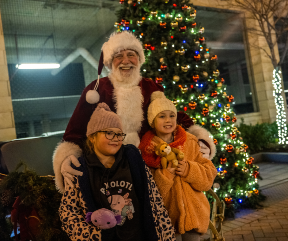 Santa with children at the Tree Lighting ceremony