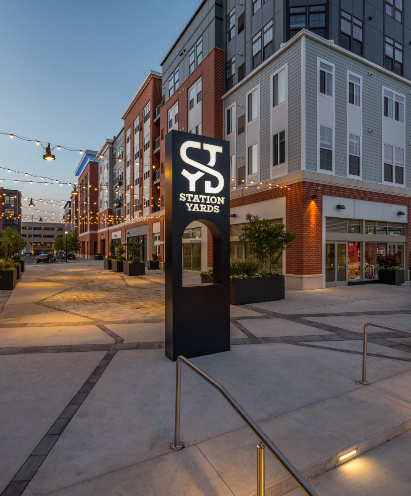 Station Yards sign above the steps from Railroad Avenue into the property