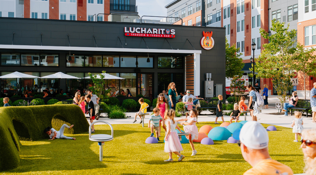 Children playing in the play area outside of Lucharitos at Station Yards