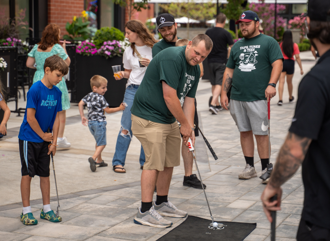 Golfers at last year's Taps, Tunes, & Tees event